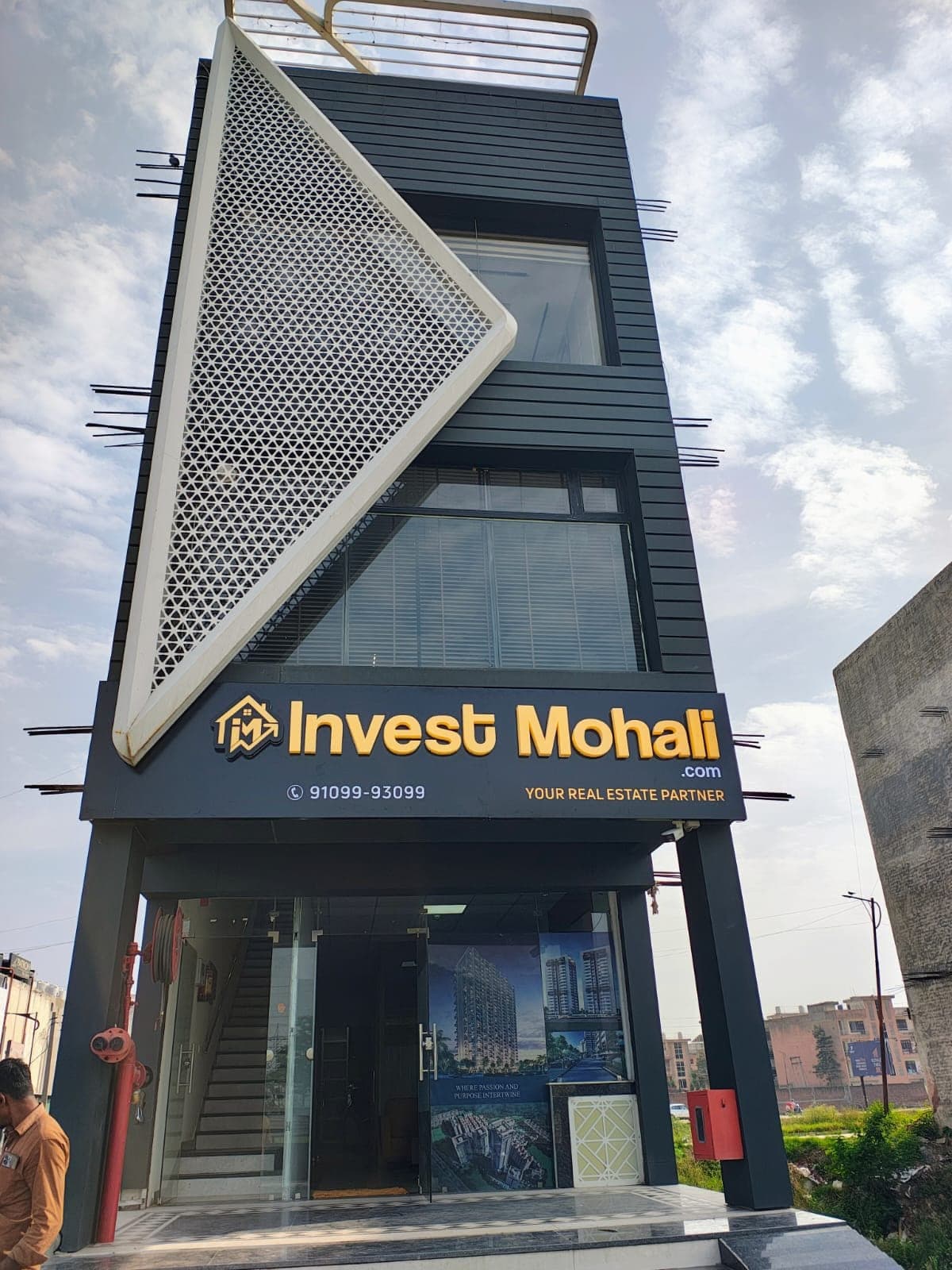 Invest Mohali real estate ACP panel sign board daytime view, Mohali Punjab by Pen to Print